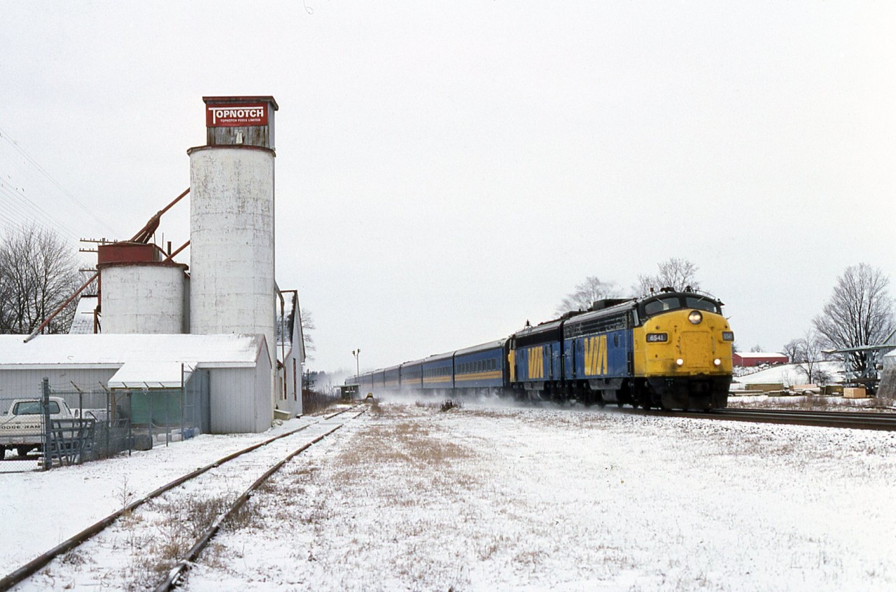 Having left London only a few minutes earlier, a pair of EB Via FP9s approach Minnie street in Dorchester. unfortunately most of the info on the slides is badly distorted, can any one shed some light on location if wrong and train number. only real memory is the sound of the units throttling up even at speed.