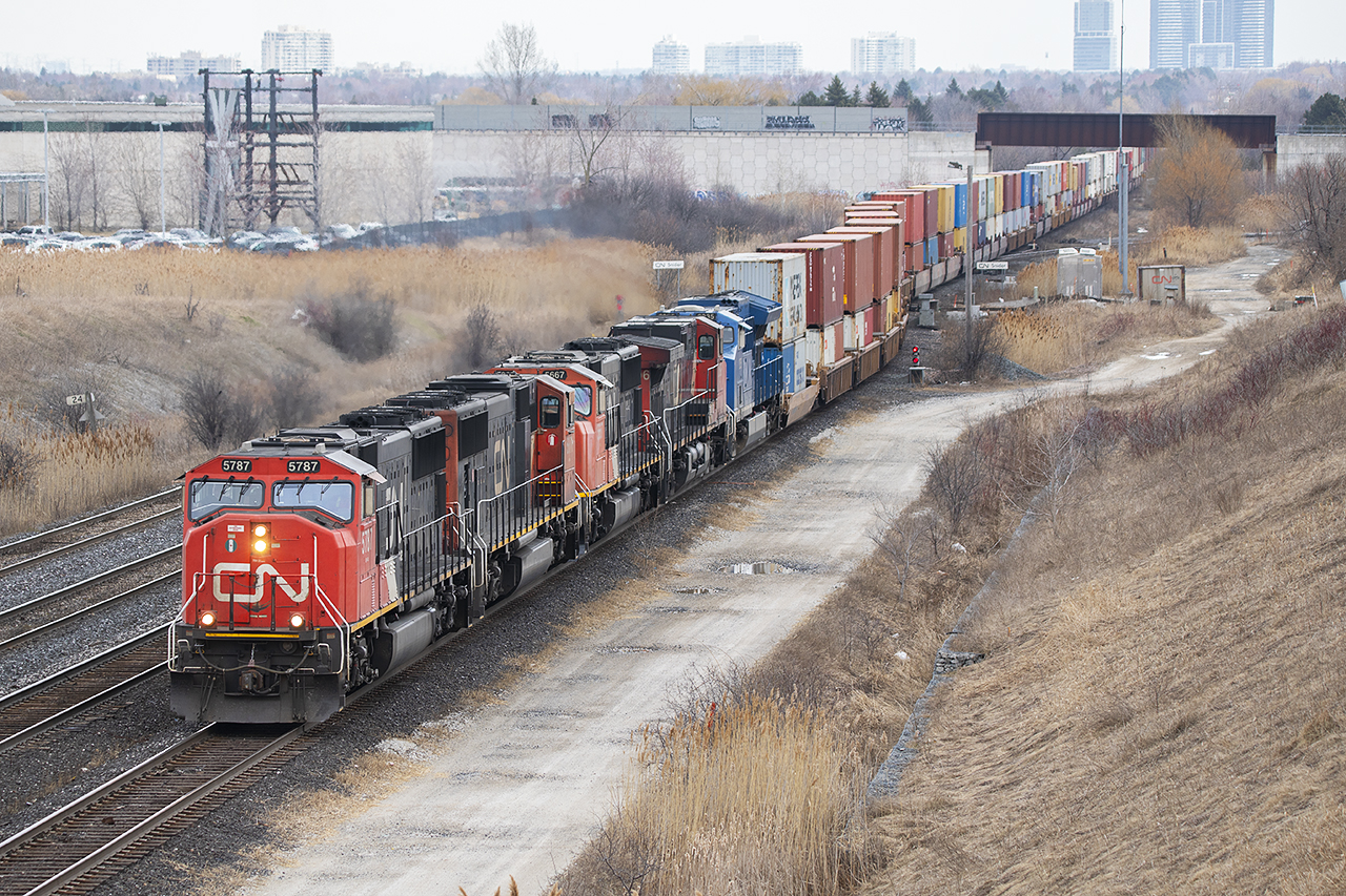 5787, 5677,5667, 2598 and GCFX 2035 wind an enormous 180 into the connecting track at Snider. They'll wait a while at the Humber because 111 has BIT all tied up. Ironically, at the same time, 384 was heading in the Halton Inbound with 8102 leading 4 other units. Perhaps even more rare than 10 engines on 2 trains passing, 384 went straight into the yard with no wait. On a Friday, that has been rare lately.

Mac Yard is a whole new world from when I worked there in the 80's. Everything seems to be done through the Dual Yardmaster including the jobs of the Receiving Control and the North Switchtender. Massive double over tracks extend from C yard down to South Control ( no idea who's controlling it, but the days of 3 or 4 yard jobs there seem to have passed). The cars shop is gone. Nothing ever stays the same.