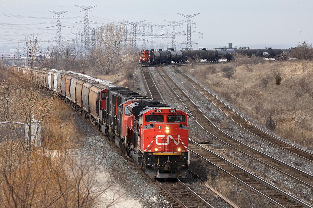 A GM day at Snider. 894 for Montreal heads through the connecting track from the Halton Sub with an SD70M-2 and 2 SD75's for power. They will be followed out by 541 with 2 GP9's; still going after 60 years.