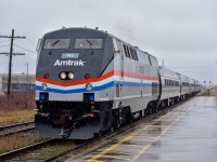 VIA 97 'The Maple Leaf' to New York Pennsylvania Station pulls into St. Catharines Station with heritage unit P42DC #145 leading the standard set of five Amfleets.