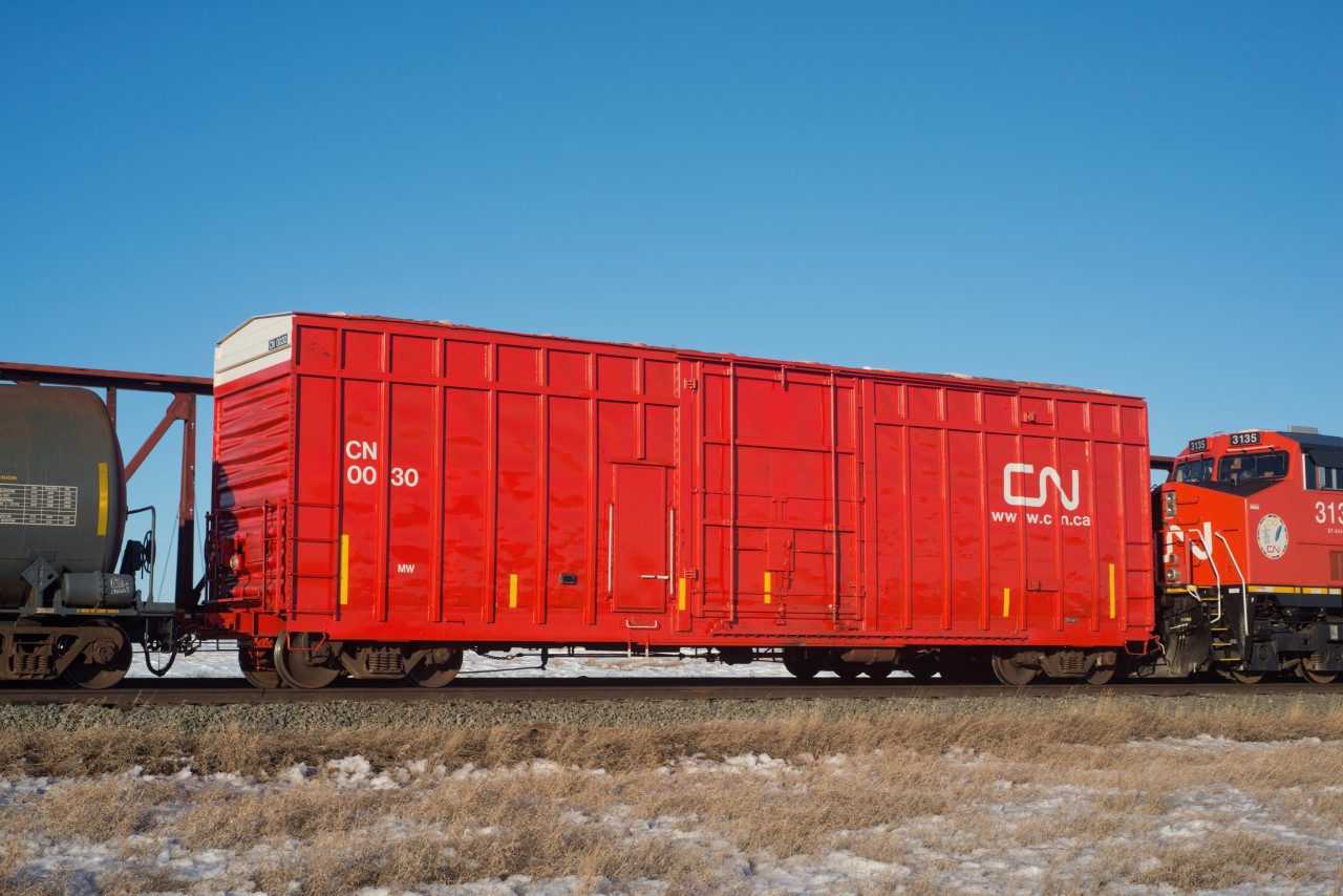 Distributed breaking car 0030 was likely just catching a ride back to Winnipeg on the head end of this 302. Normally these cars are positioned mid-train or on the tail end.