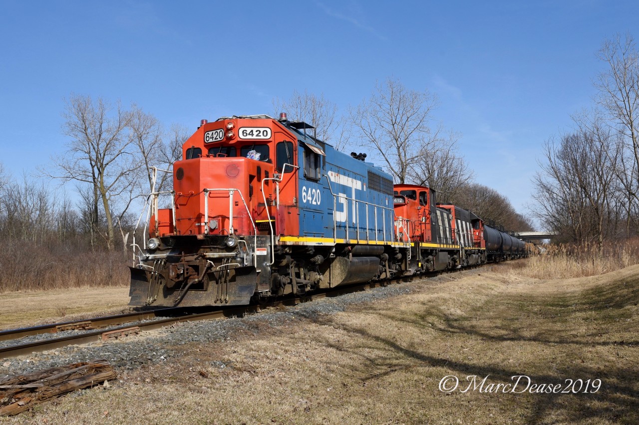 Having caught 393 earlier I decided to pass on it as it came through Sarnia when I saw the GTW leader on the St. Clair Industrial as it was departing south bound. Here they are about to cross Tashmoo Road with GTW 6420, CN 1412 and CN 4713.