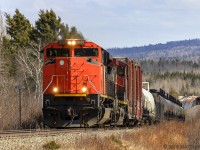 One of the few CN engines missing it's front noodle, CN 8007 leads train 406, as they approach Passekeag, New Brunswick, on a warm Spring afternoon. 