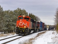 After the last snowfall of the year (hopefully), train 406 rounds the bend, at Rothesay, New Brunswick. 