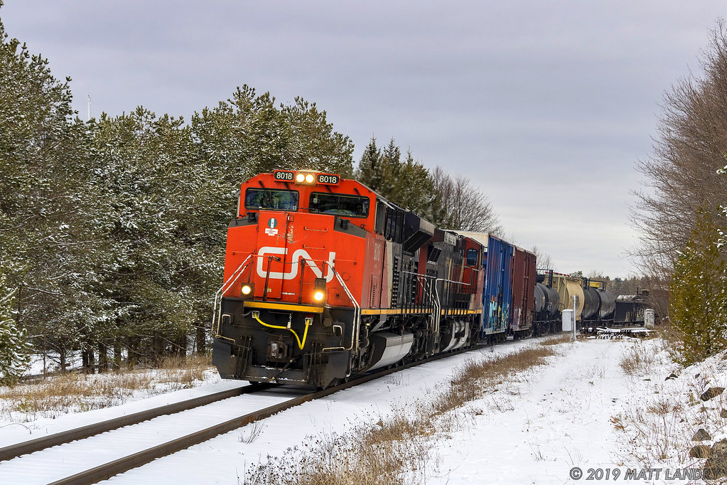 After the last snowfall of the year (hopefully), train 406 rounds the bend, at Rothesay, New Brunswick.