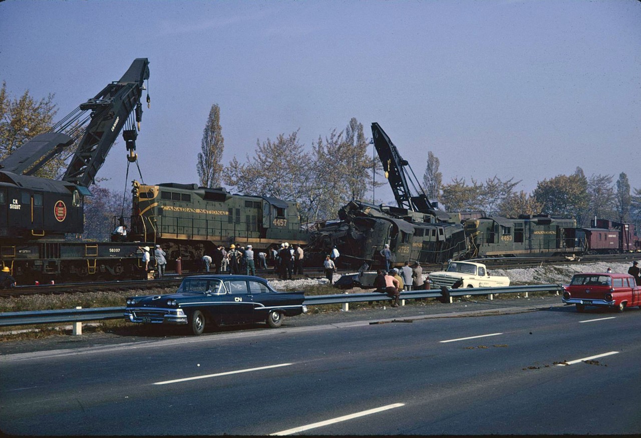 The clean-up continues after two CN movements collided head-on just to the west of Sunnyside Station.  Luckily there were no fatalities, but CN did call in the CP big hook to assist. Looking back, it is amazing how you could pull over on the Gardiner Expressway, and even get that close to the action without being challenged.
Oh how times have changed.