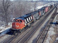 GP40-2L (W) trio CN 9540, 9418 and 9474 are seen from Waterdown Road bridge westbound on a very pleasant morning. This location is of interest because off on the North (left) side is the site of the present day Aldershot GO station and parking lot. It was all so different back in 1977, and one would be hard pressed to find any connection with today's busy scene.