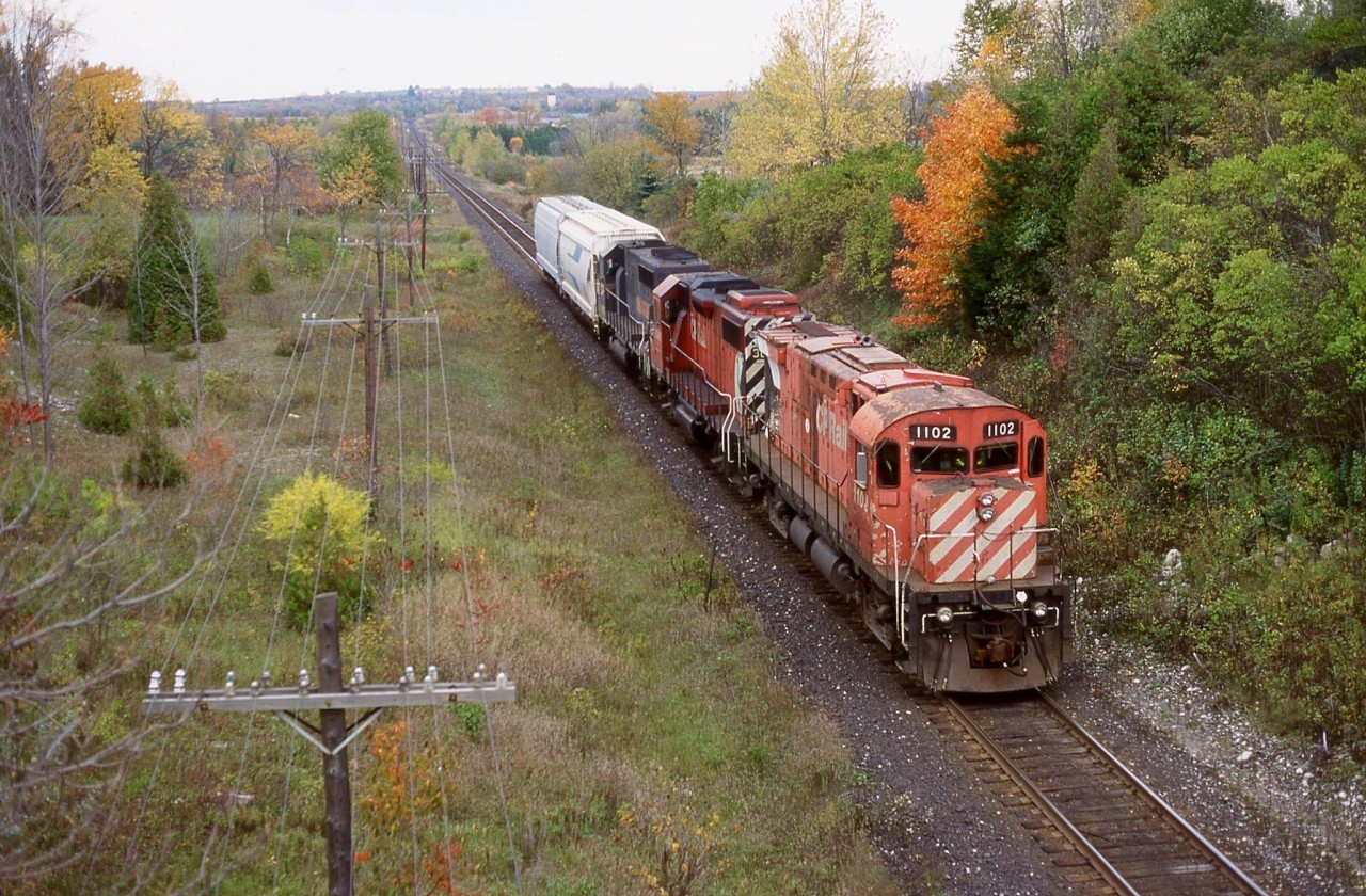 My notes say train 925 if that makes sense. Definitely “Ham turn” or “London Pick - up”. The day was a typical dreary fall day but I couldn’t resist following any train with a MLW in the lead no matter if it was dead or alive. The fact that there were only two covered hoppers in tow from the OSR interchange leads me to believe this was most likely the “London Pick-up”. Nevertheless the train at this point was overpowered but eventually grabbed more tonnage as it headed west. I still like the vantage point off Highway 6 even today it’s just too bad you take your life in your hands shooting off that bridge.