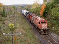 My notes say train 925 if that makes sense. Definitely “Ham turn” or “London Pick - up”. The day was a typical dreary fall day but I couldn’t resist following any train with a MLW in the lead no matter if it was dead or alive. The fact that there were only two covered hoppers in tow from the OSR interchange leads me to believe this was most likely the “London Pick-up”. Nevertheless the train at this point was overpowered but eventually grabbed more tonnage as it headed west. I still like the vantage point off Highway 6 even today it’s just too bad you take your life in your hands shooting off that bridge.