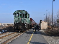 That’s my ride to the 2019 Elmira Maple Syrup Festival!! <br> <br> Just before 9am on the first Saturday of April (which is usually the day Elmira hosts its annual Maple Syrup Festival), the Waterloo Central Tourist Train is seen paused just north of the Farmers Market Road crossing in North Waterloo and passengers walking down Waterloo Central’s actually new freshly paved platform at the Market who will soon board the train and from there, the train will take them and mysel to the festival! 