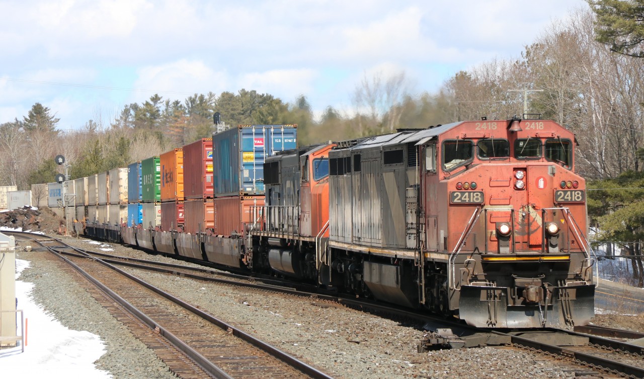 CN 2418 lead's a heavy intermodal train east in South Parry.