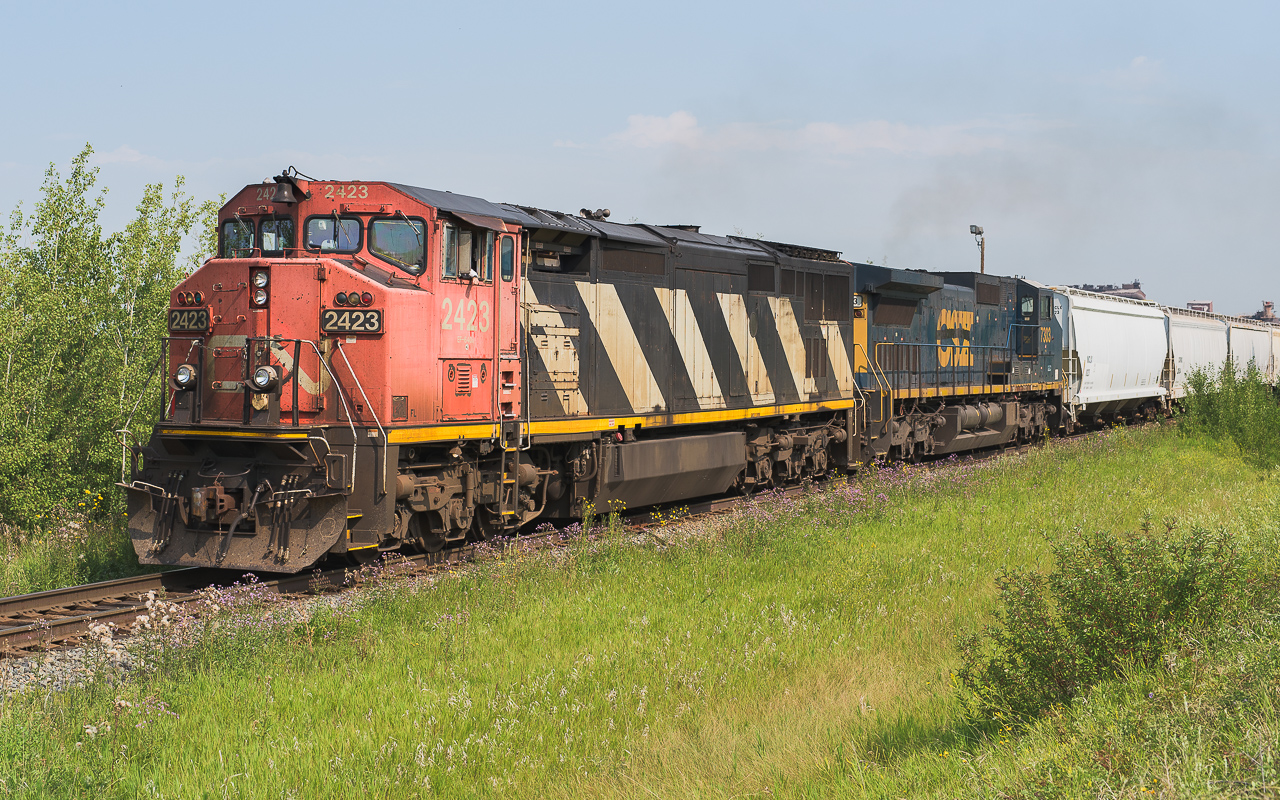 CN 2423 and GECX 7303 are on the way to Calgary with a mixed freight.