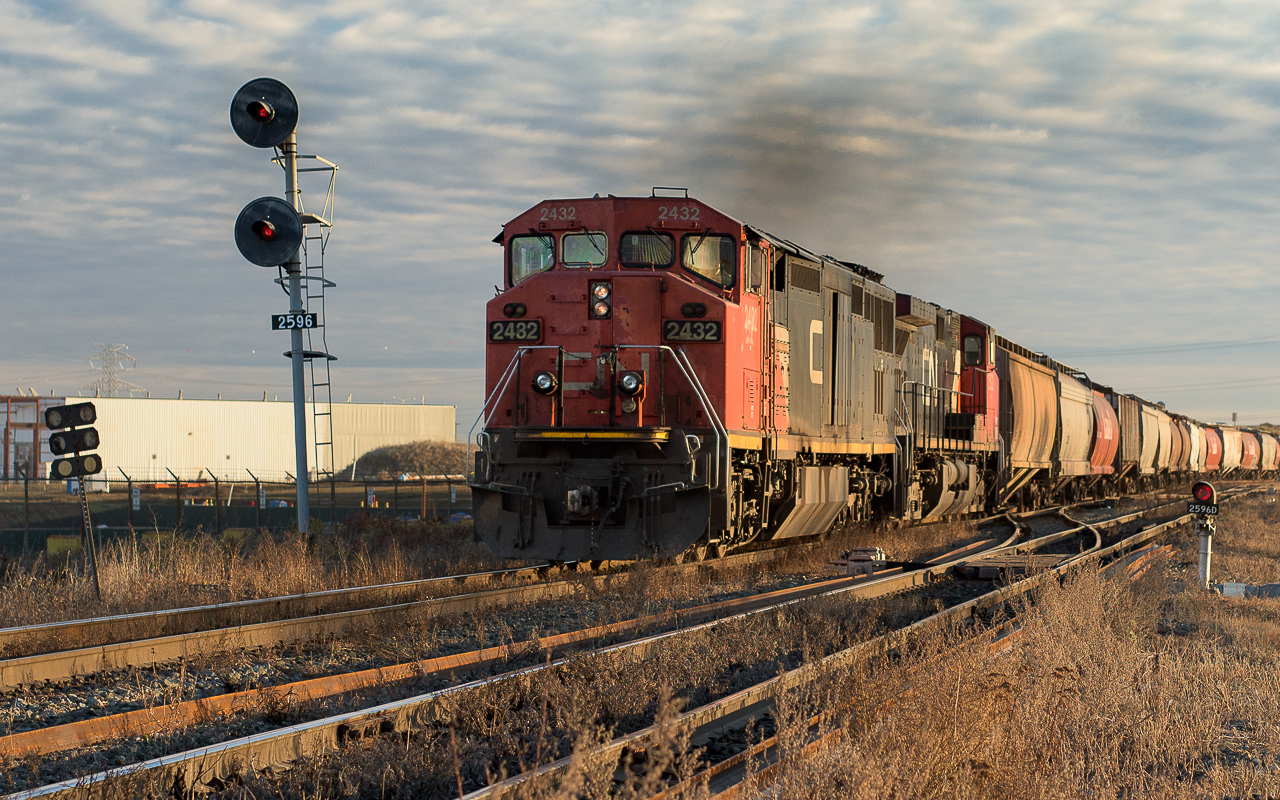 CN 2432 and 2582 are approaching Bretville Jct. at 8:50 with a train of grain loads.