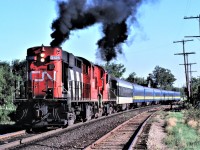 CN train 169, otherwise known as the Barrie Commuter, accelerates out of Maple, Ontario after making its station stop.  A pair of MLW RS-18s, 3126 and 3115, put on a fine show!