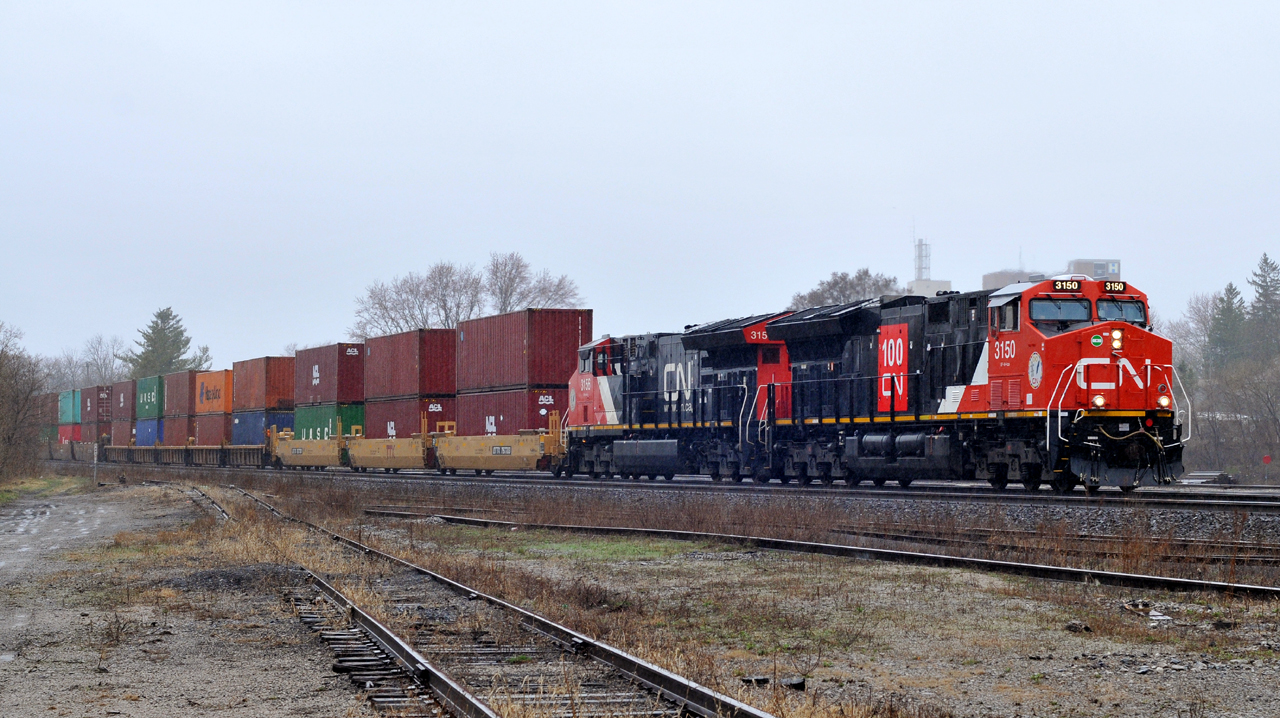 CN 3150, and CN 3156 bring Q14891 18 through Brantford with 158 cars on a rather dull and dreary April afternoon.

3150 is sporting a logo in celebration of CN's 100th anniversary