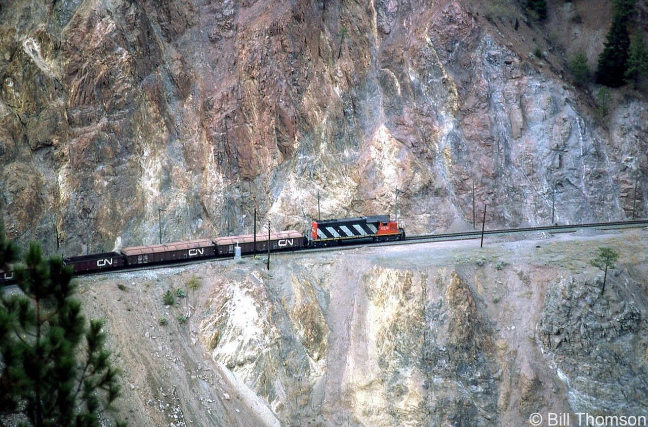 CN SD40 5236 leads an eastbound freight solo, traversing CN's line along the inside of the Thompson River canyon in September of 1984.