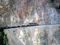 CN SD40 5236 leads an eastbound freight solo, traversing CN's line along the inside of the Thompson River canyon in September of 1984.