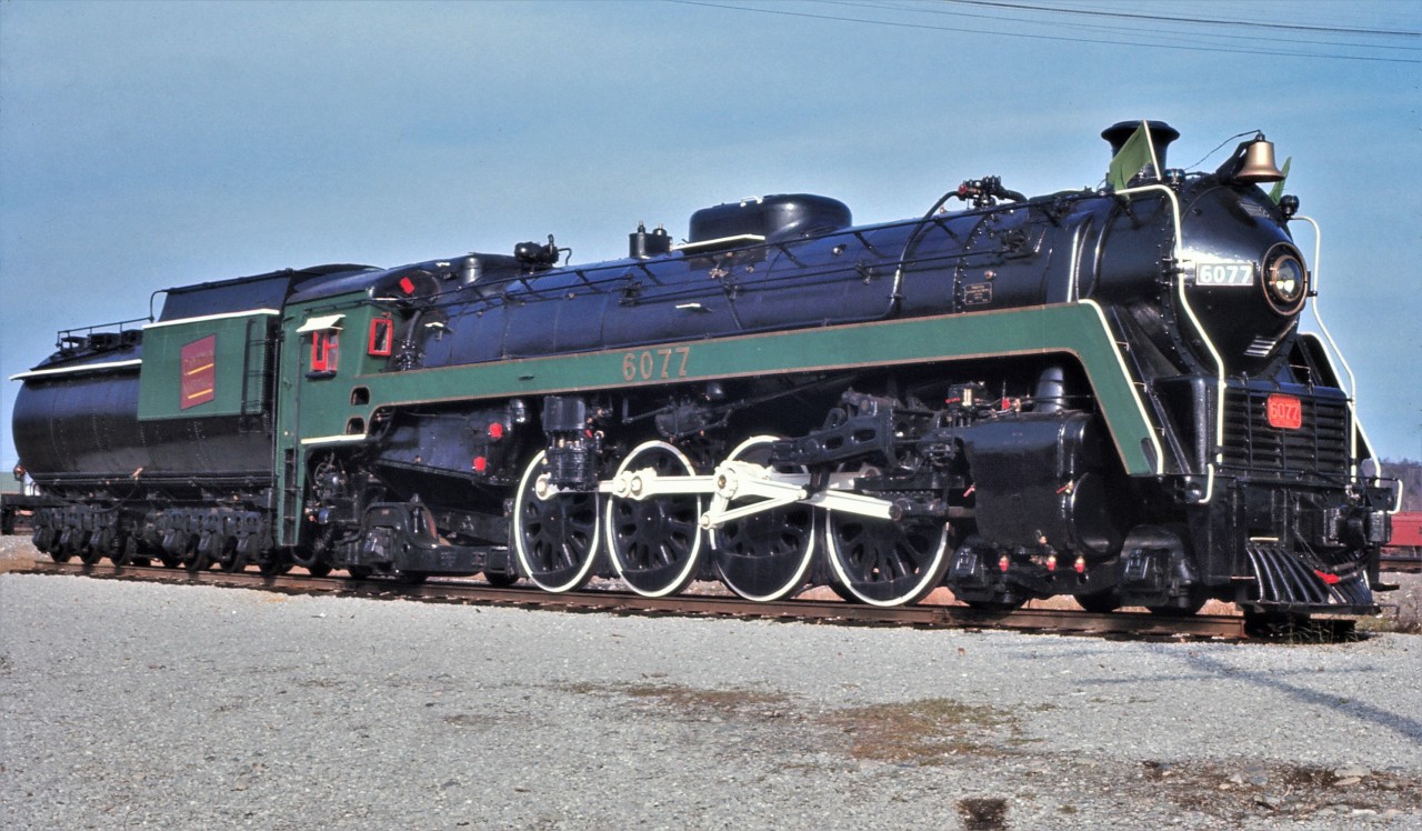 After a fresh coat of paint at the Capreol roundhouse, CN 4-8-2 #6077 was moved to its resting place in Prescott Park in July 1967.  6077 is now one of two steam locomotives, plus several other pieces of equipment, at what is now known as the Northern Ontario Railway Museum and Heritage Centre.  During a subsequent cosmetic restoration, the bright "forest green paint" was corrected.