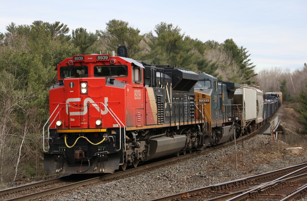 CN 8939 lead's a heavy mixed freight west in South Parry, It will cross over here onto CP's Parry Sound Sub for most of it's journey to Sudbury. Mid train DPU was CN 2691.