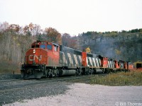 A westbound CN freight heads through Dundas with GP40-2LW units 9443 and 9457 leading a GP9, SW1200RS and van on the head end.