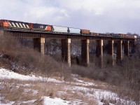 A pair of 2400's lead 385 over the single track Credit River bridge on the east end of Georgetown Ontario. This structure has changed significantly in the years since. 