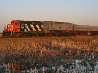 CN 999 crawls westward along the Wainwright Sub near Poe, AB., behind a westbound freight meeting an eastbound ahead. And another eastbound, and another eastbound, and another. Busy times, everybody gets to wait. Thanks to TDS for the heads up. 1749hrs.