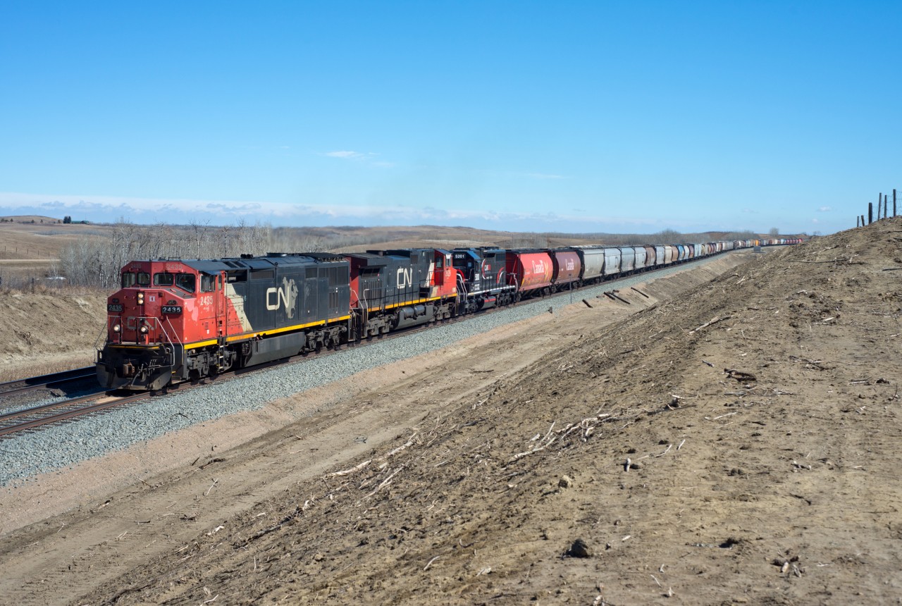 CN 821 is about to cross the provincial border between Saskatchewan and Alberta. CCGX 5201, an exDMIR SD38AC is along for the ride. This area was opened up thanks to last year's double-tracking project.