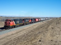 CN 821 is about to cross the provincial border between Saskatchewan and Alberta. CCGX 5201, an exDMIR SD38AC is along for the ride. This area was opened up thanks to last year's double-tracking project.  