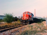 CN GP9RM 4111 leads the 15:30 Kitchener local down the Huron Park Spur in Kitchener less than a month before the original of takeover of the Goderich-Exeter Railway in November 1998. In the last two decades this area has changed dramatically with the installation of the GO Transit layover facility and the CTC installation on the Guelph Subdivision. Thank you to Stephen Host for all the photo editing work on this one. 