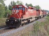 Here is one of those second hand SD40 rebuilds with quite a history, CP SD40M-2 5492 started life as C&O 7531built as a non-Dash-2 SD40, it eventually was renumbered to CSX 8390 before being retired and sold to NRE and renumbered 8390. It later went to Morrison Knudsen and was again renumbered MKCX 9418, In 1995 MK upgraded it into a Dash-2 and sold it to CP. It remained on CP's roster until 2012 when it was retired. Here it is seen leading train 167 into Guelph Jct. on a pleasant July day with three other SD40-2's trailing.
