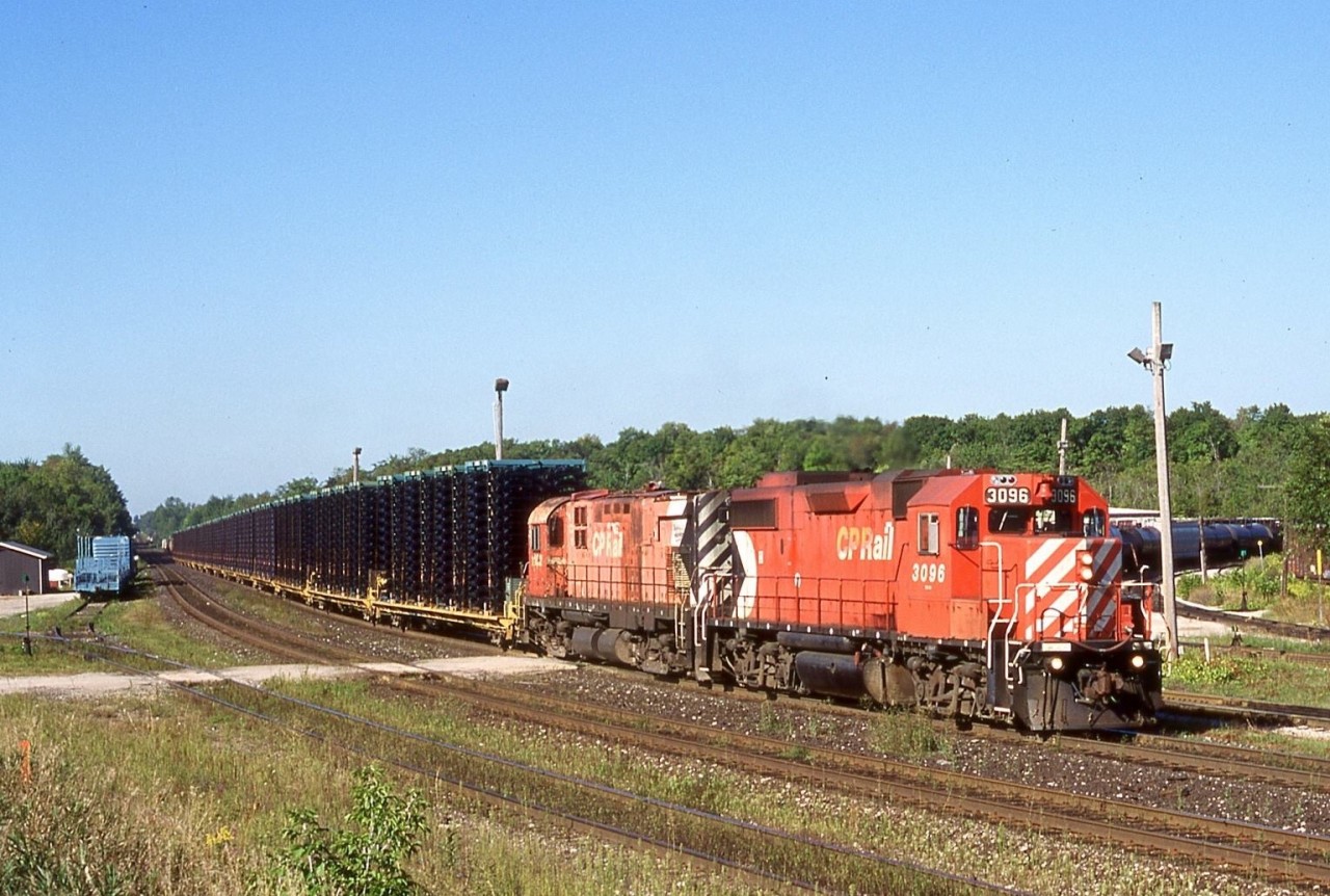 Mornings were always a good time on CP back in the early to mid 2000’s, with typically 3-4 trains through the junction within a 2-3 hour period. “Sprint” frame trains 141/142 through much of the 2000’s were pretty much the hottest trains running on the Galt subdivision and loaded train 142 was the best catch of the two considering it was loaded rather then simply empty flat cars like its counterpart. Running as a fairly light train and with no turning facilities at both St. Thomas and Oshawa. Control cab sets were typically the power for the train. While power set 1117 and 3057 were the normal power for the train it was possible to get another set filling in. September 5, 2001 was one of those days as I watched 3096/1102 pass my vantage point up on the hill at Guelph Jct. A lot has changed in the past 18 years at the junction since I framed this train and even the train today doesn’t exist.