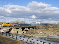 VIA 37 crosses the Lachine Canal with VIA 911 leading a Renaissance set.