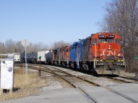 CN 538 with CN 4708, GMTX 2260, CN 4140 & CN 4787 is shoving a cut of cars towards Coteau Yard.