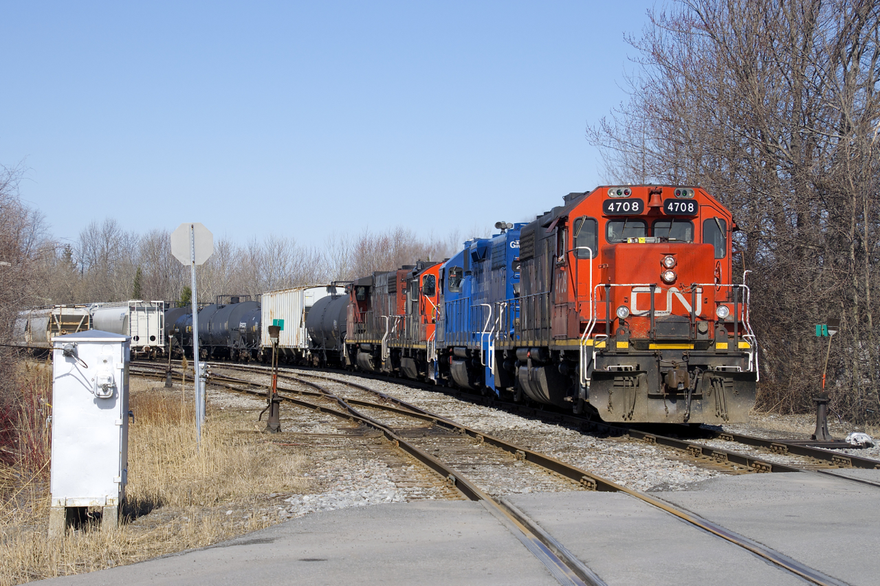 CN 538 with CN 4708, GMTX 2260, CN 4140 & CN 4787 is shoving a cut of cars towards Coteau Yard.