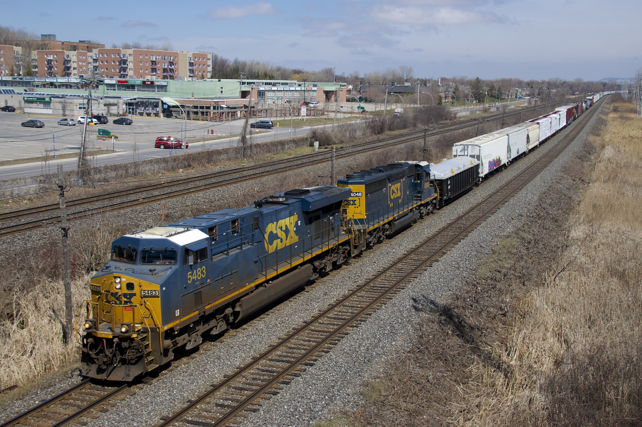 CN 327 with CSXT 5483, CSXT 4048 and 74 cars passes MP 14 of CN's Kingston Sub.