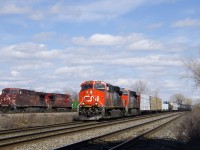 CN 377 with a pair of ES44AC's (CN 2946 & CN 2870) is heading west through Dorval as it passes CP 143 with a pair of AC4400CW's (CP 9759 & CP 8569) on the parallel CP Vaudreuil Sub. CP 143 will take off in a few minutes once the conductor is onboard.