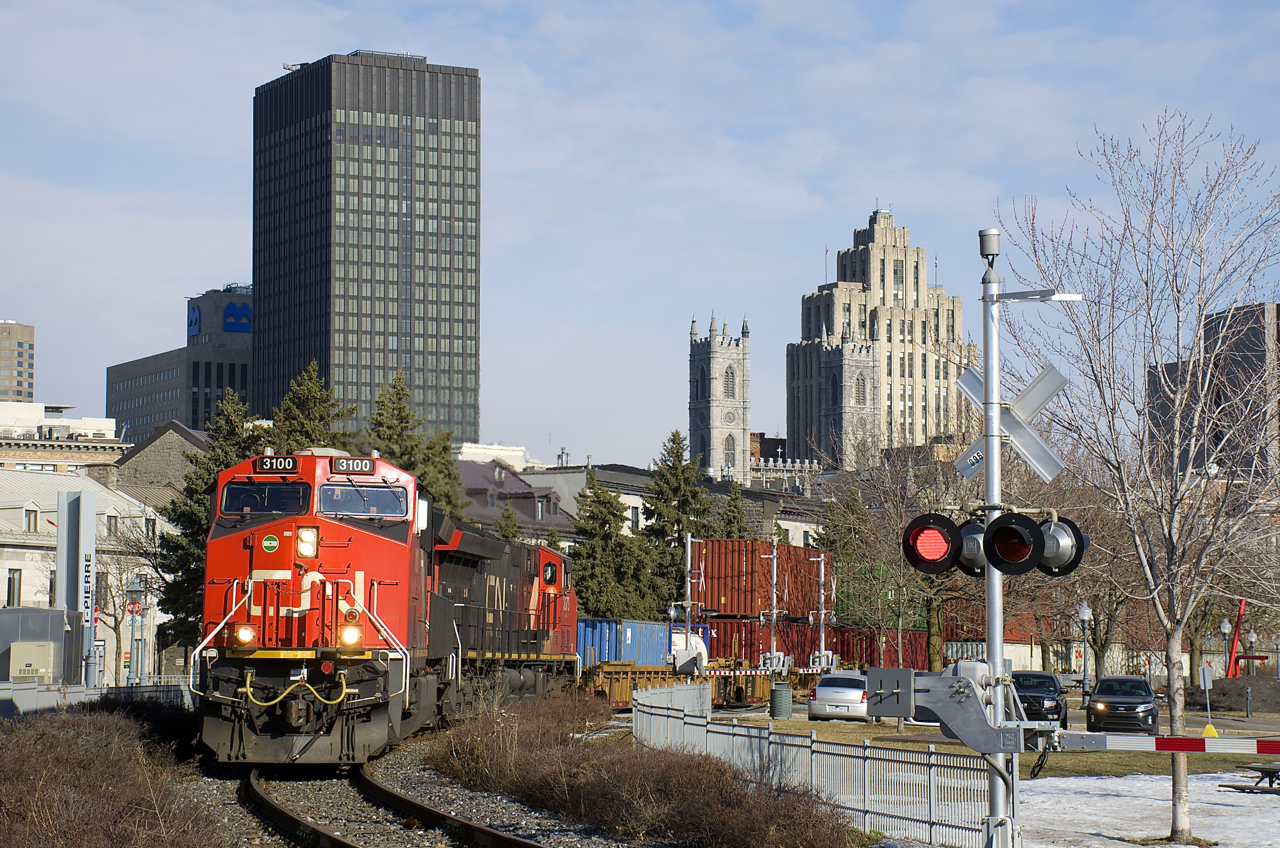 CN 149 has ET44AC's CN 3100 & CN 3073 and about 12,000 feet of intermodal traffic as it leaves the Port of Montreal.
