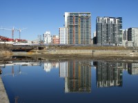 A week after visiting Montreal, AMTK 145 is back in town as it pushes the <i>Adirondack</i> past the Peel Basin on a windless and sunny morning.