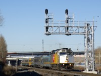 Wrapped VIA 6437 leads VIA 22 as it heads east on the north track of CN's Montreal Sub. In the background is the new Turcot interchange, with the old one largely demolished at this point.