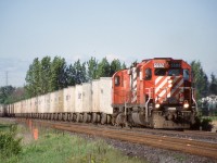 This location near the top of the small valley has always been a favourite location for me, especially if anything was lined westbound on my way home from work. Back in the 2000’s the Triple Crown Roadrailer was pretty reliable late in the afternoon. This day SD40 5592 and control cab 1104 are in charge as the storm westward with a sizeable train of trailers.