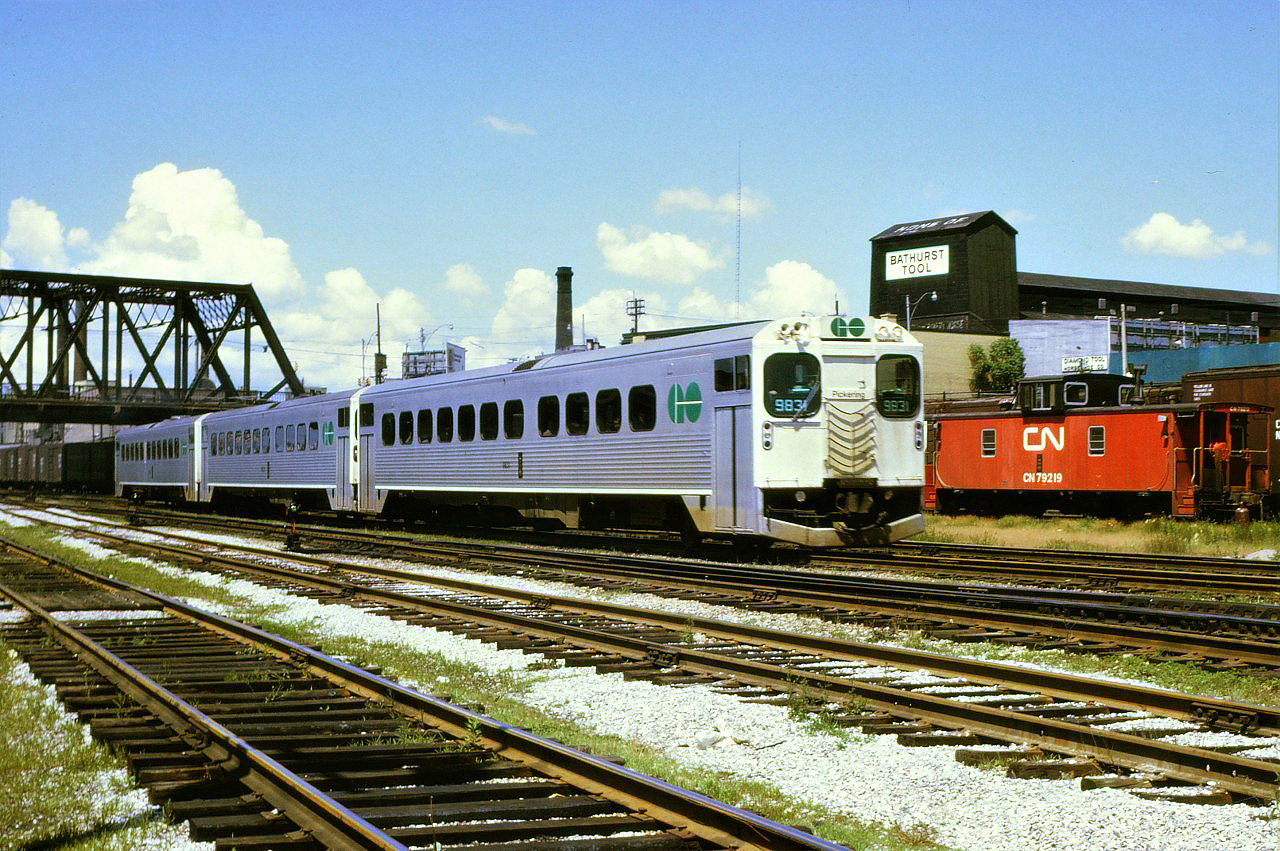 On a quiet Sunday afternoon, a trio of GO Transit self propelled cars approach Toronto Union Station from the west.