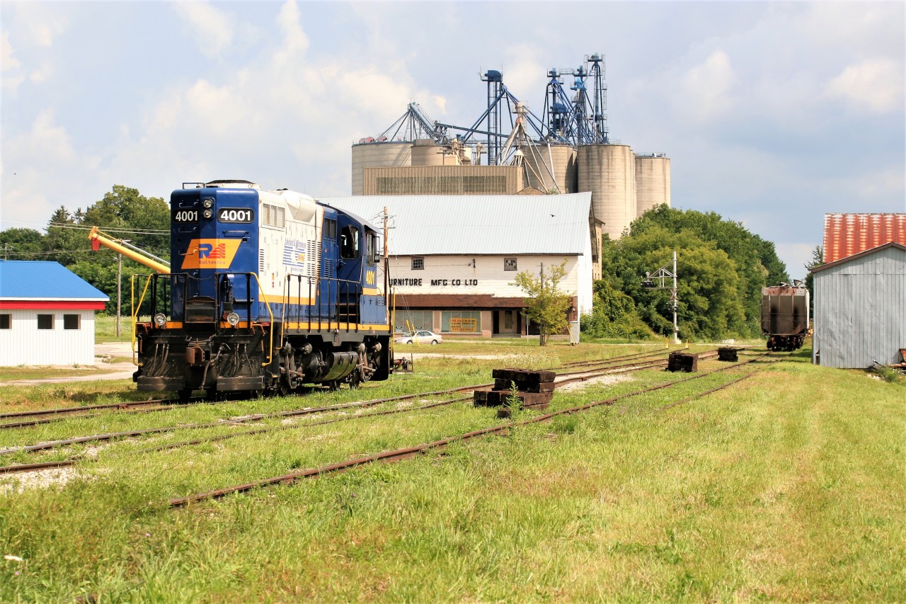 The scene at Clinton after Goderich-Exeter Railway (GEXR) train 581 set-off GP9 4001 before continuing their trek from Goderich to Stratford on the Goderich Subdivision. In the near future, the unit will be used to service the railway's Exeter Spur, which at the time served customers between Clinton and Centralia.