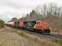 A very nice pair of GMD, SD75i's in CN 5701.2 and CN 5707 lead windmill train 307 around the bend to mile 30 on the Halton sub. Naturally, its cold, rainy and damp when the good trains come. Being mainly a CP guy, it was sure unusual to catch seven CN trains in two and a half hours with still more to come. That could be 3 days worth in my area of the Galt sub!!!