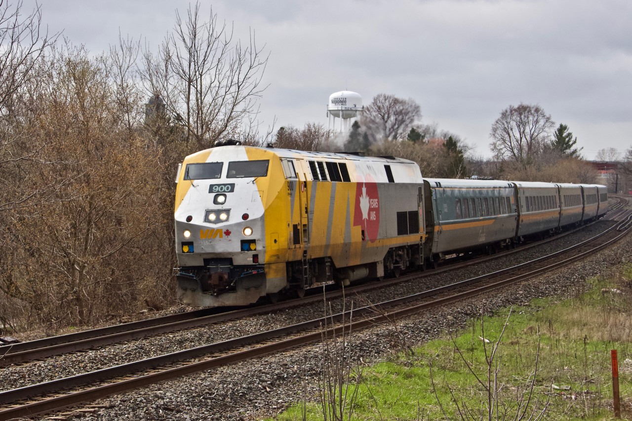 Via Rail Train 44 after crossing the Napanee Viaduct heads on its way to Ottawa on a gloomy Saturday afternoon. Locomotive 900, a GE P42DC is looking equally as gloomy, sporting the 40th Anniversary motif. Photo was taken from a ridge on the South side of the bridge looking Northward and at the top of the Viaduct.