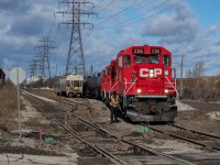 TH41 is pictured here near Ottawa Street in Hamilton, on the Beach Branch at the interchange. The two hoppers in the foreground are empties for Bunge, and the crew is about to cross Ottawa Street to clear a switch and shove back on the track to tie on a third hopper. They referred to the three as "the three Bunge hoppers", though they'd set off a Nova Chemicals hopper which I thought was odd. My instinct was correct, and I saw CN return the hopper to CP at Adams Yard the very next day, noted in the caption of this shot  <a href="http://www.railpictures.ca/?attachment_id=36947">here</a>. To see CN working this interchange, I posted a shot of them lifting cars <a href="http://www.railpictures.ca/?attachment_id=37107">here</a>.