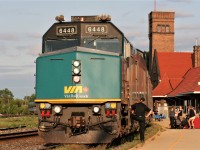 The engineer of VIA Rail train 79 looks on as passengers and baggage unloads at Brantford, Ontario on a pleasant July evening. 