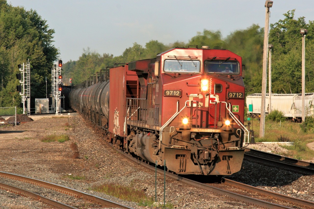 A Canadian Pacific ethanol train is eastbound through Guelph Junction with 9712 and 8719 as tail-end DPU on an early August morning.