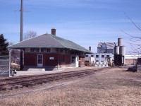 When looking for information regarding this image, nothing was as I thought it to be. Yes, this is the old CPR station in Listowel. This was the former CP Listowel sub. But the line, built in 1908 from Linwood to end of the line by the station, was abandoned by the CPR in 1939. So why is it active with a lumber car being unloaded in 1981? Apparently CN took over the station and enough track to switch local industries as their connection was close by. So, in this picture we can say this is a CN operation. And the station building was leased out to Ontario Hydro. Nice solid looking building, but it did not make it thru the 1980s before it was demolished. Further, the CN pulled out of Listowel altogether in 1993.