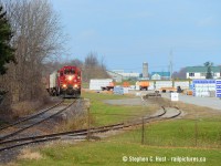 After lifting 20 cars from FS Partners of Ayr, the Ham Turn breaks the silence of this rural-rooted community with blasts of the horn as they approach Guthrie St. There is one other customer in Ayr, Tampa Hall at right, who makes trusses and floors amongst other products for the housing industry. I don't know if Tampa Hall is actively using rail but I rarely have seen a car in there.<br><br>

I know very little about the history of the Ayr Pit spur - but you can see remnants of a line that ran along Greenfield Rd and I believe the pit was just south of it. You can tell the line's been here quite a long time though. It makes for a nice branchline feel though and why I'm attracted to it<br><br>
Thanks to <a href=http://railpictures.ca/author/Aleks-Stefanovic target=_blank>Aleks Stefanovic</a> for alerting me to this one fine morning in Paris. Got some bucket list shots off my todo list.