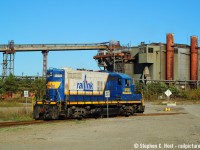 The Southern Ontario Railway is seen working In the shadow of a giant, in this case, Stelco. The building in background is all that remains of the "D" Blast furnace complex, most of which was demolished in the early to mid 2000's (which would have stood at left). I'm not sure what this structure is used for, but it's still there today. This was back when you could drive back into some of the port lands, as long as you didn't get caught by port patrol. It was all fenced off around 2011. Corrections welcome.